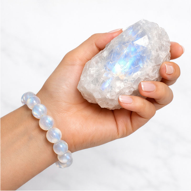 hand holding moonstone with lunara bracelet on the wrist